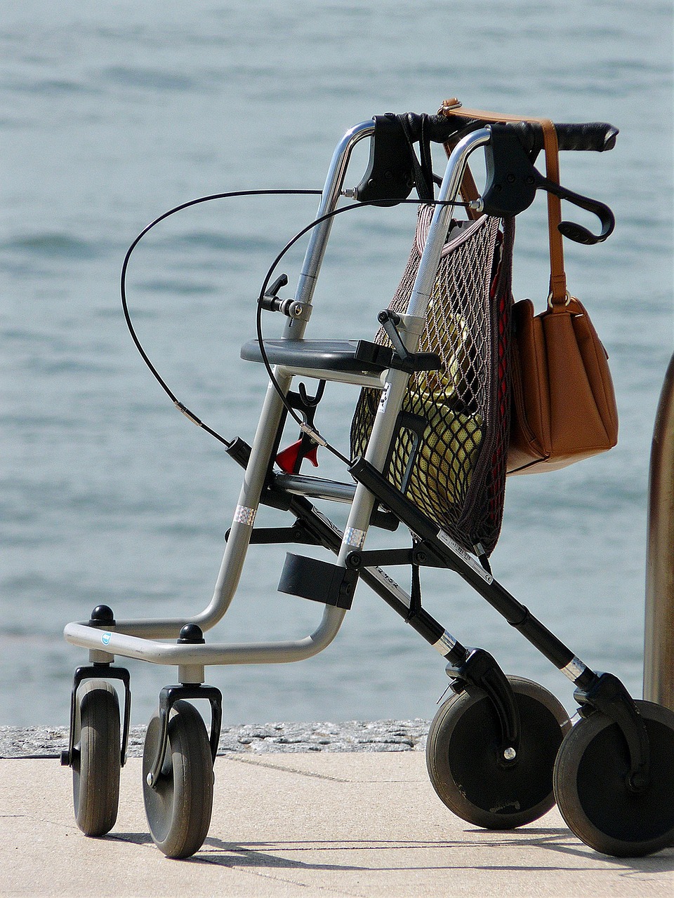 A Rollator walker is placed on the road