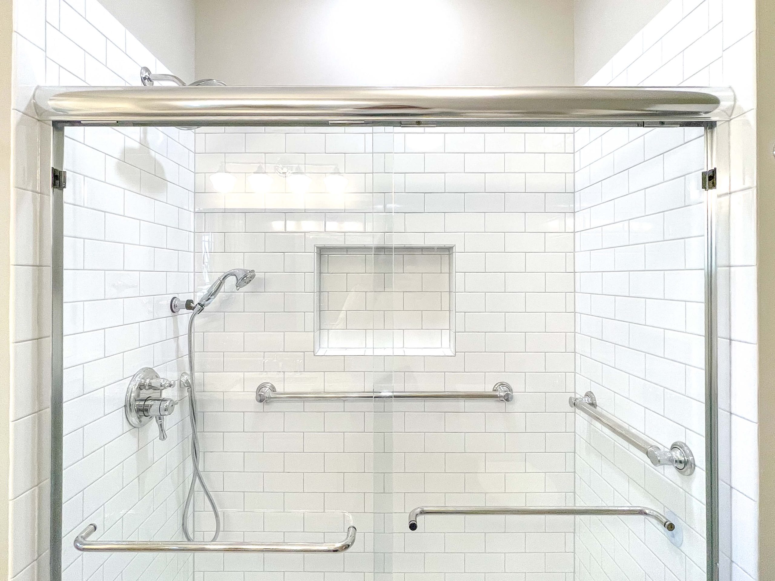 a bathroom with Safety rails