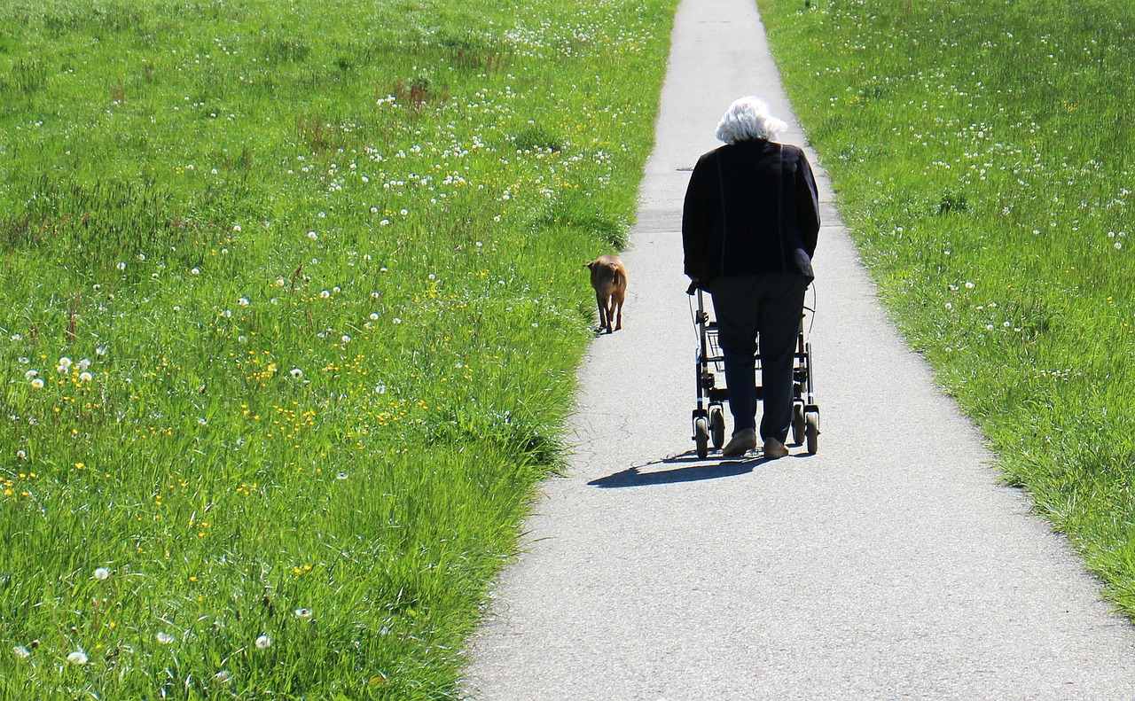 an old man walking along the road